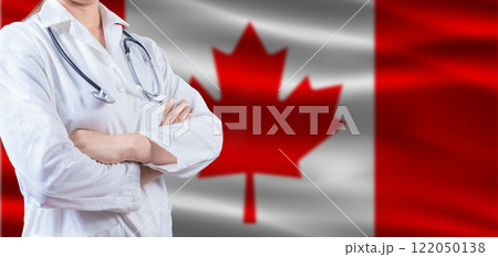 Doctor with crossed arms on Canada flag. Canada Health and Care concept. Female doctor on Canada flag 122050138