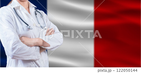 Doctor with crossed arms on France flag. France Health and Care concept. Female doctor on France flag 122050144