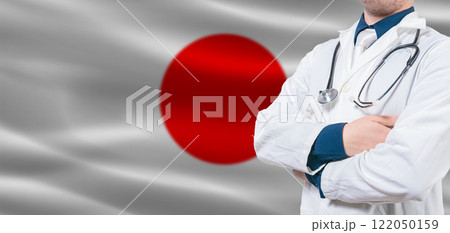 Japan Health Care concept. Male doctor on Japan flag. Doctor with crossed arms on Japan flag. 122050159