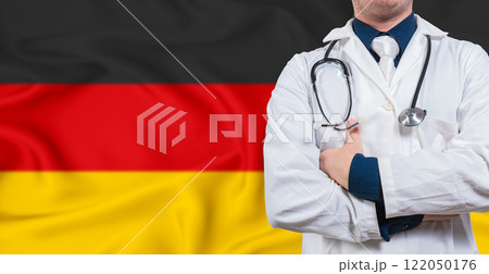Male doctor with stethoscope on Germany flag. Doctor holding stethoscope on Germany flag Male doctor with stethoscope on Germany flag. Doctor holding stethoscope on Germany flag 122050176
