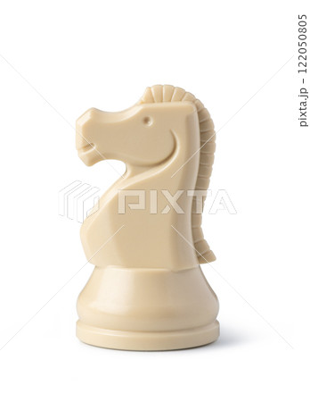 White knight chess piece standing on white background 122050805