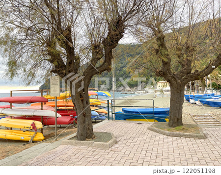 Beach and trees of Liguria near sea. Nature of Mediterranean Sea in winter. Background for design.  122051198