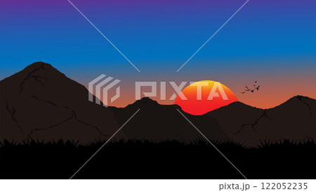 A striking silhouette of mountains against a vibrant sunset sky 122052235