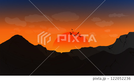 A striking silhouette of mountains against a vibrant sunset sky 122052236