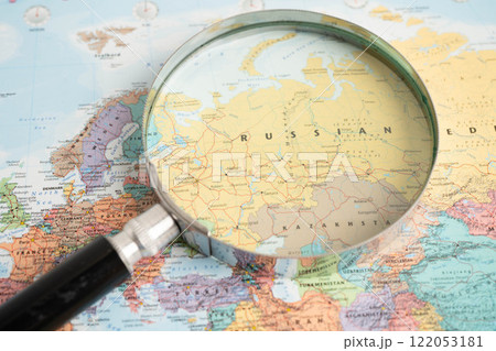 Bangkok, Thailand May 15, 2022 Magnifying glass on world map. Bangkok, Thailand May 15, 2022 Magnifying glass on world map. 122053181