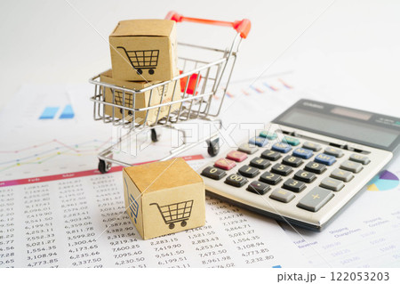 Online shopping, Shopping cart box on business graph, import export, finance commerce. Online shopping, Shopping cart box on business graph, import export, finance commerce. 122053203