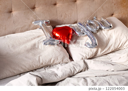 "I love you" from balloon on the bed. Valentine's concept. 122054003