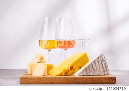 A delectable arrangement of various cheeses and wine A delectable arrangement of various cheeses and wine 122054710