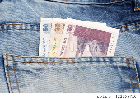 Latvian lats in the pocket of blue jeans Latvian lats in the pocket of blue jeans 122055710