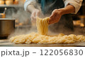 Close up of professional chef serving pasta while working in kitchen. High quality illustration 122056830