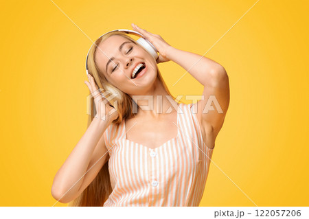 Best Music App. Carefree Teen Girl Listening Her Favorite Song In Wireless Headphones 122057206