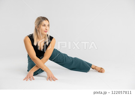 Dancer performing modern dance on white background Dancer performing modern dance on white background 122057811