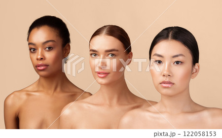 Three Attractive Women Models Posing Shirtless Looking At Camera Over Gray Background. Studio Shot. Beauty Diversity Concept Three Attractive Women Models Posing Shirtless Looking At Camera Over Gray Background. Studio Shot. Beauty Diversity Concept 122058153
