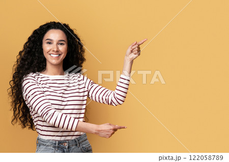 Best Offer. Cheerful Middle-Eastern Couple Pointing At Copy Space In The Middle, Joyful Young Arab Man And Woman Demonstrating Free Place For Your Advertisement On Yellow Background, Panorama Best Offer. Cheerful Middle-Eastern Couple Pointing At Copy Space In The Middle, Joyful Young Arab Man And Woman Demonstrating Free Place For Your Advertisement On Yellow Background, Panorama 122058789