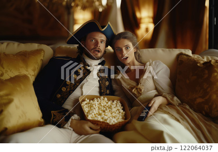 Historical Couple Watching TV with Popcorn 122064037