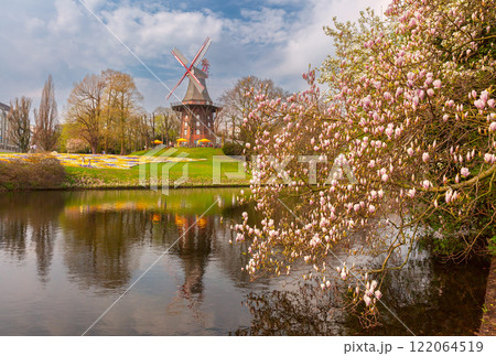 Spring flowers and a windmill on the wall, Bremen, Germany Spring flowers and a windmill on the wall, Bremen, Germany 122064519