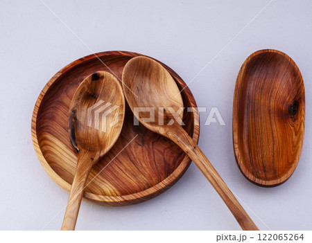 Wooden kitchen utensils stacked view close up isolated Wooden kitchen utensils stacked view close up isolated 122065264
