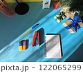 Various office items near a small Christmas tree 122065299