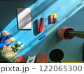 Various office items near a small Christmas tree 122065300