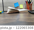 The book is on the office desk . High-quality photo 122065308