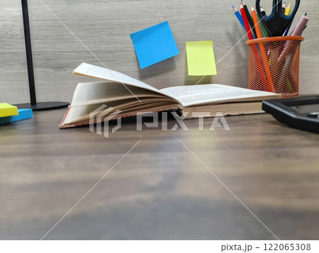 The book is on the office desk . High-quality photo The book is on the office desk . High-quality photo 122065308