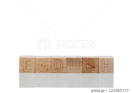 Wooden cubes with letters enough on a white background Wooden cubes with letters enough on a white background 122065777