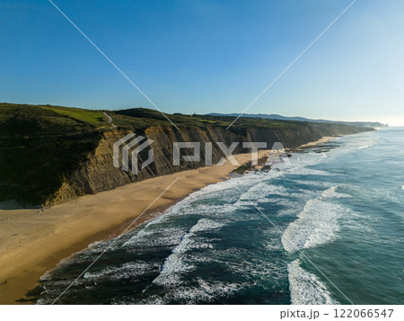 Magoito Beach and Cliffs on Sunny Day. Atlantic Ocean, Portugal. Aerial View Magoito Beach and Cliffs on Sunny Day. Atlantic Ocean, Portugal. Aerial View 122066547