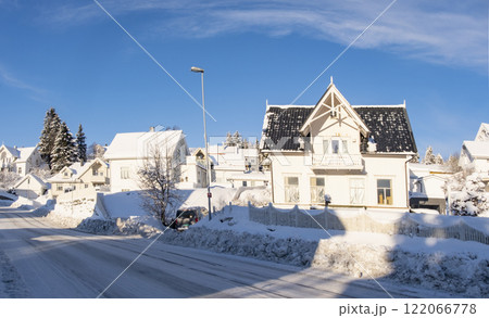Norwegian town of Troms in the winter. Snowy arctic city with colorful houses and port 122066778