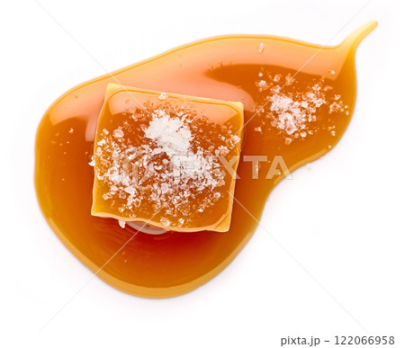 salted caramel candy in melted caramel sauc salted caramel candy in melted caramel sauc 122066958