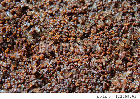 Close up of coarse brown sugar and coffee granules blended together in a texture Close up of coarse brown sugar and coffee granules blended together in a texture 122069363