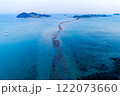 Tourists crossing Jindo-gun's miracle Sea Road revealed by low tide 122073660