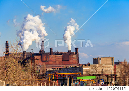 View of old factory with pipes with smoke. Air pollution, environmental damage 122076115