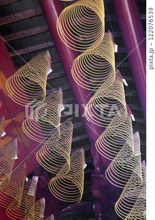 Spiral incense burning hanging in Vietnamese temple 122076539