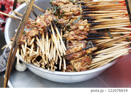 Small brochettes with cooked meat 122076634