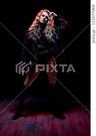 A Bold Portrait of a Confident Woman in a Chic Leather Jacket with Attitude and Grace A Bold Portrait of a Confident Woman in a Chic Leather Jacket with Attitude and Grace 122077069