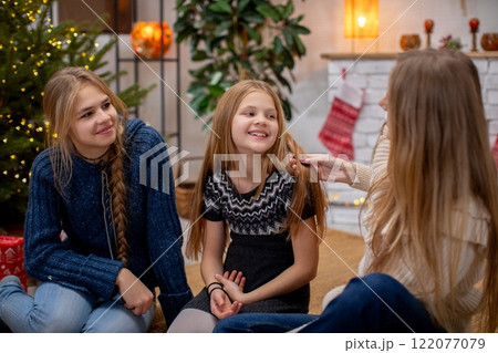 A Cozy Family Gathering Filled with Joy and Cheerfulness During the Festive Holidays 122077079