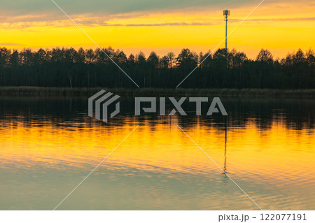A Majestic and Stunning Sunset Reflection Over the Calm Waters of Natures Beauty 122077191