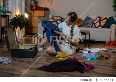 Pack efficiently for your next trip by organizing clothes and accessories to minimize stress 122077214