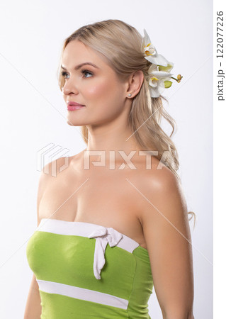 This is a beautiful portrait of a Woman adorned with Flowers in her Hair and a lovely Green Dress 122077226