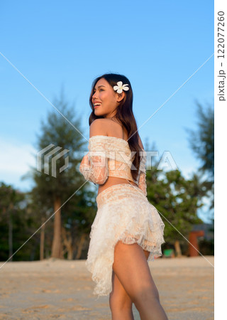 Beautiful Young Thai Woman at Tropical Beach During Sunset 122077260