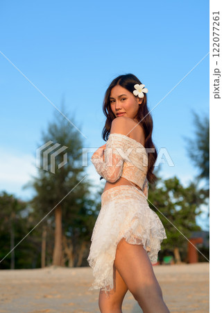 Beautiful Young Thai Woman at Tropical Beach During Sunset 122077261