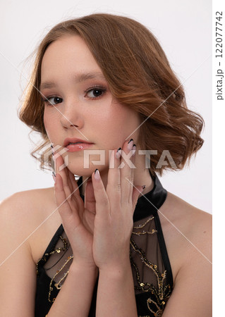 An Elegant and Stunning Portrait of a Young Model with Glamorous and Artistic Makeup 122077742