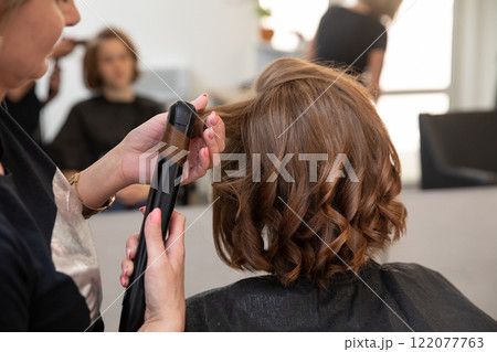 Experience Stylish and Trendy Hair Curling at a Contemporary and Inviting Hair Salon Experience Stylish and Trendy Hair Curling at a Contemporary and Inviting Hair Salon 122077763