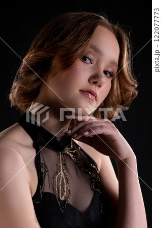 An Elegant and Striking Portrait of a Young Model with Short Hair and Glamorous Makeup An Elegant and Striking Portrait of a Young Model with Short Hair and Glamorous Makeup 122077773