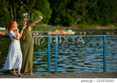 Joyful and Memorable Moments by the Water Capturing Beautiful Friendship and Fun in Nature 122078265