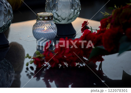 Stunning and Elegant Evening Decor featuring a Beautiful Candle and Bougainvillea Flowers 122078301
