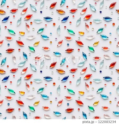 Colorful glass beads scattered on white creating fun abstract background. Many shiny little seashell shaped elements, flat lay. AI-generated 122083234