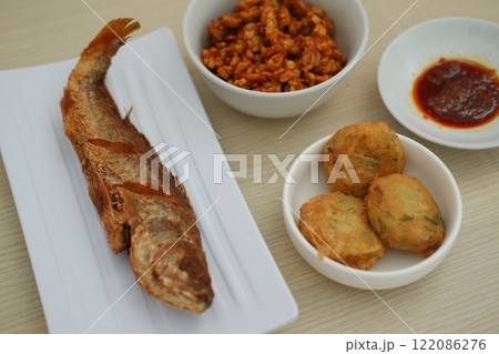 traditional Indonesian food arranged neatly on a table surface traditional Indonesian food arranged neatly on a table surface 122086276