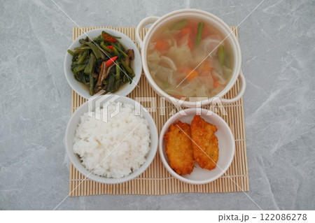 traditional Indonesian food arranged neatly on a table surface traditional Indonesian food arranged neatly on a table surface 122086278