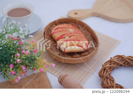 Strawberry bread with chocolate drink on white background Strawberry bread with chocolate drink on white background 122086294